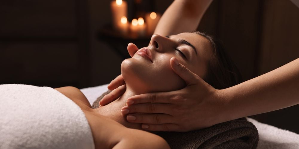 Woman receiving a massage at a local day spa.
